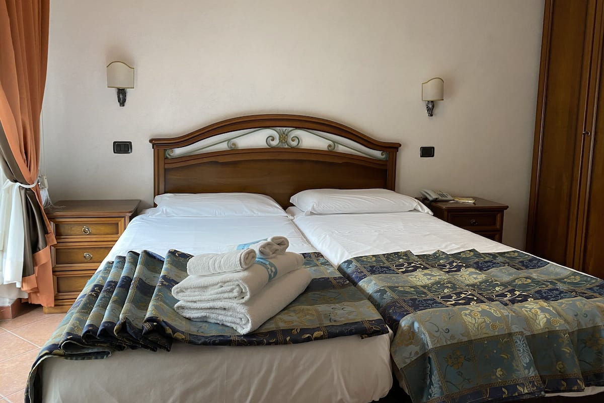 Shower, eco-friendly toiletries, hair dryer, slippers