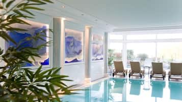 Indoor pool, outdoor pool, open 7:00 AM to 7:00 PM, pool loungers