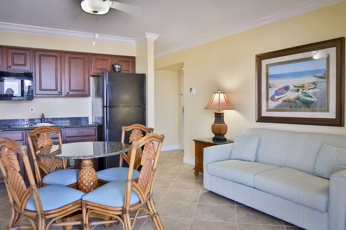Deluxe Room, Beach View | Living area | 37-inch flat-screen TV with digital channels, TV