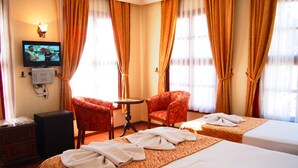 A hotel room with two beds, a television, a table, and a chair. - Reutlingenhof Boutique Hotel - Special Class (Antalya)