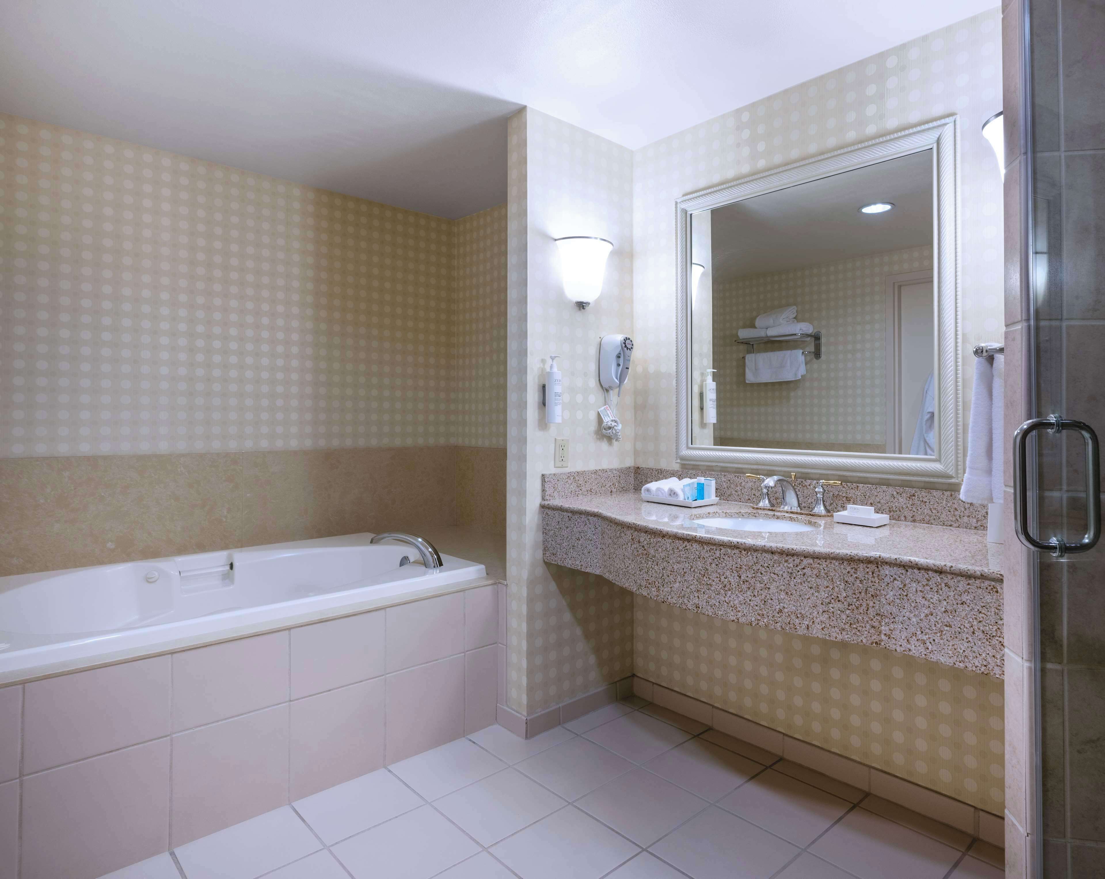 suite, one king bed, non-smoking | bathroom | free toiletries, hair dryer, towels, soap