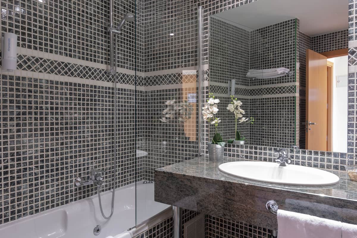 standard triple room (3 adults) | bathroom | deep-soaking bathtub, hair dryer, bidet, towels