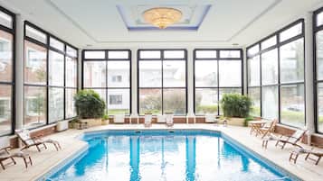 Indoor pool, open 10:00 AM to 10:00 PM, pool loungers