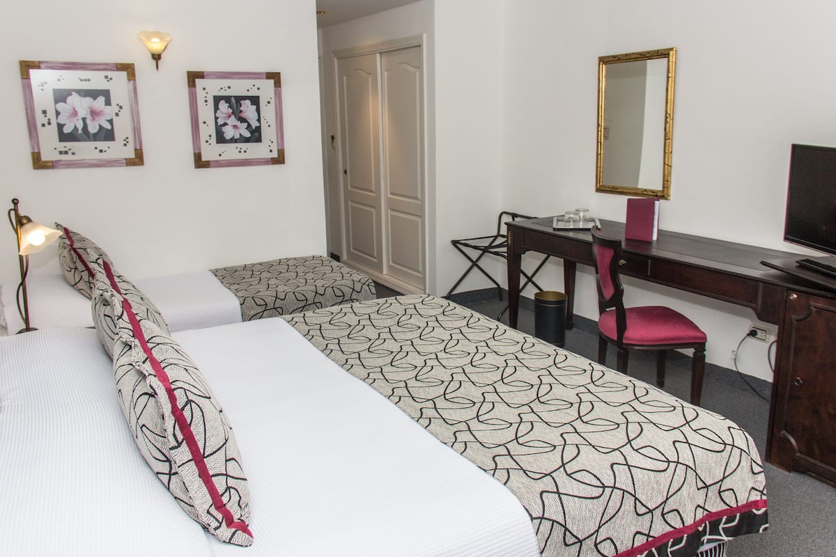 Superior Triple Room | Minibar, in-room safe, desk, free WiFi