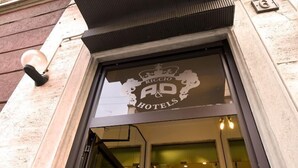 A hotel entrance with a sign reading "Riccio AP Hotels". - Hotel Sabatino (Milan)