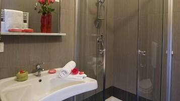 Shower, free toiletries, hair dryer, towels