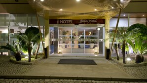 A hotel entrance with a sign reading 'HOTEL Boa Cristal,' a tiled pavement, and potted plants. - Baia Cristal Beach & Spa Resort (Lagoa)