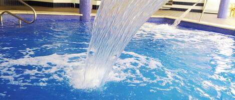 Indoor pool, outdoor pool, pool umbrellas, pool loungers