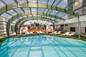 Indoor pool, pool umbrellas, sun loungers