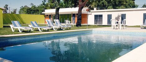 Seasonal outdoor pool, pool loungers