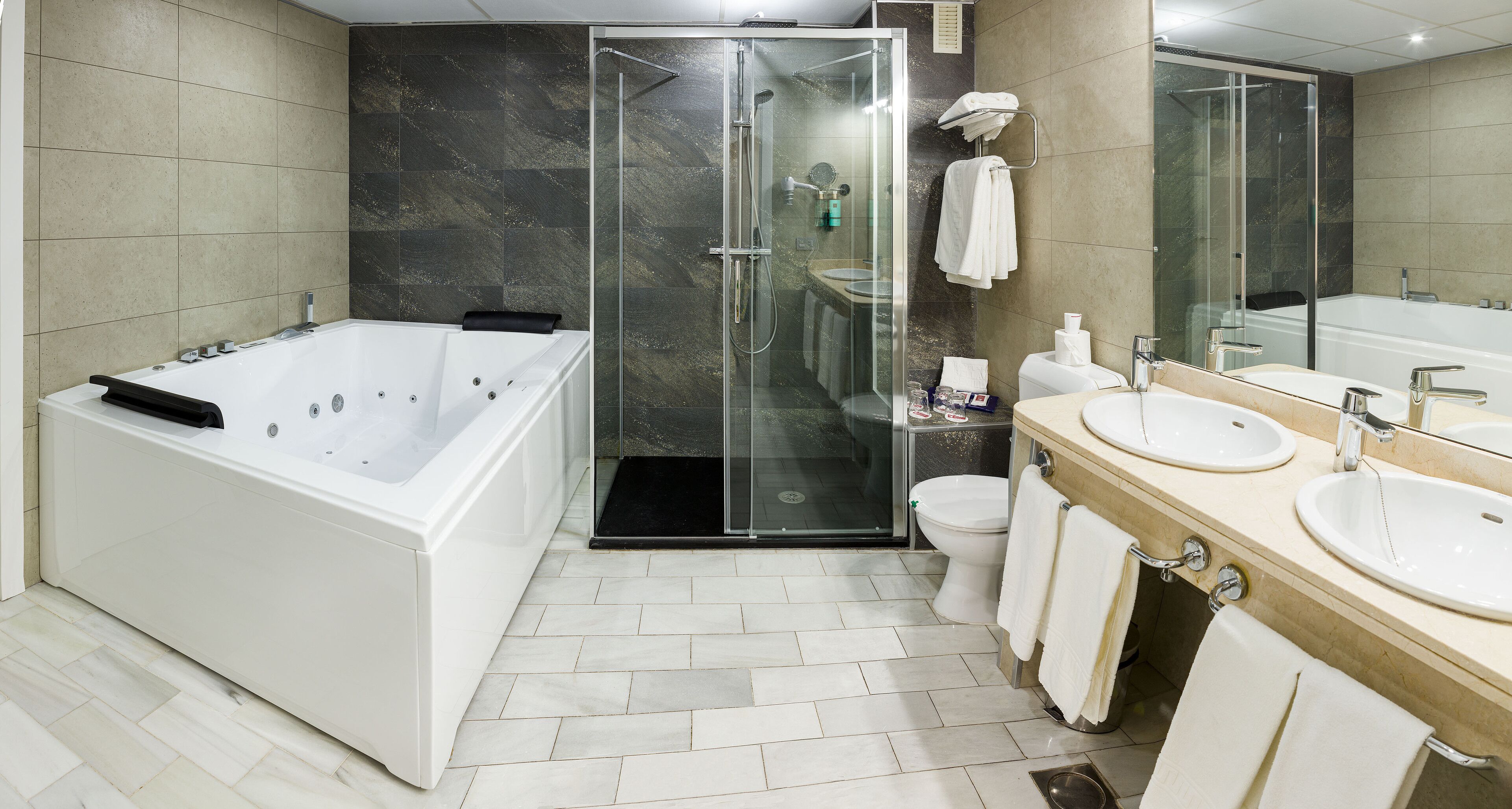 junior suite, 1 queen bed with sofa bed | bathroom | designer toiletries, hair dryer, bidet, towels