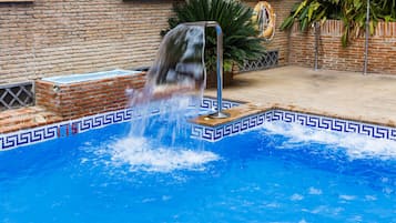 Seasonal outdoor pool, open 10:00 AM to 9:00 PM, pool umbrellas