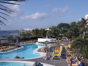 2 outdoor pools, open 10:00 AM to 6:00 PM, pool umbrellas, pool loungers