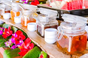 A variety of jars with different contents, possibly for beverages, arranged on a wooden surface. - 4Reasons Hotel And Bistro | 12+ (Bodrum)
