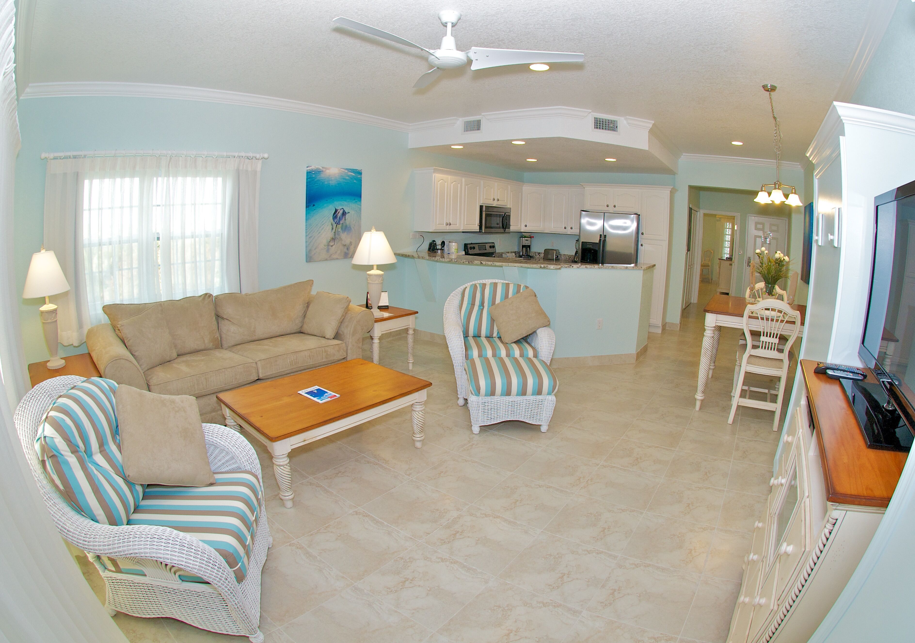 deluxe condo, 1 bedroom, poolside | living area | 42-inch flat-screen tv with cable channels, tv, dvd player