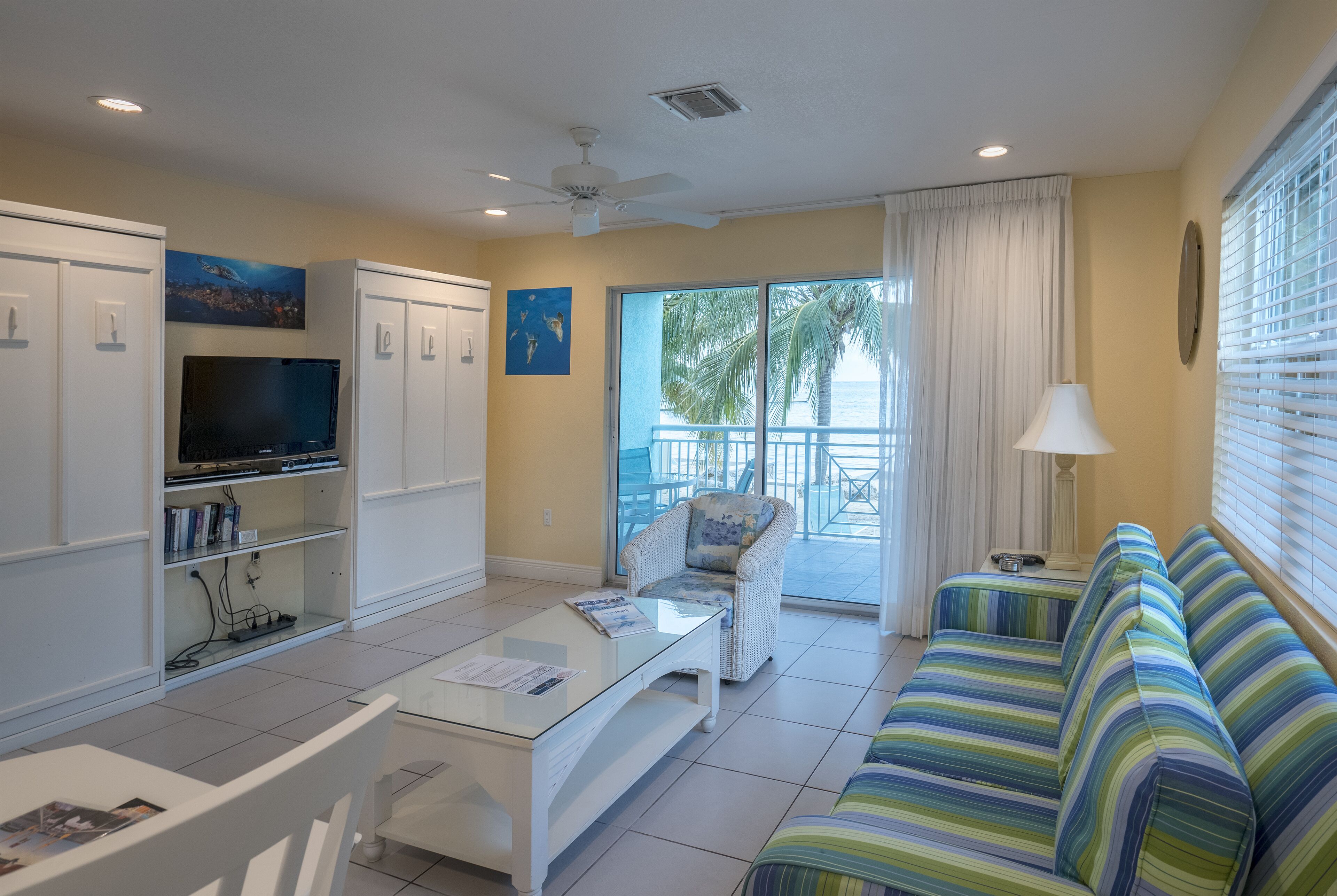 signature condo, 1 bedroom, beach view, oceanfront | living area | 42-inch flat-screen tv with cable channels, tv, dvd player
