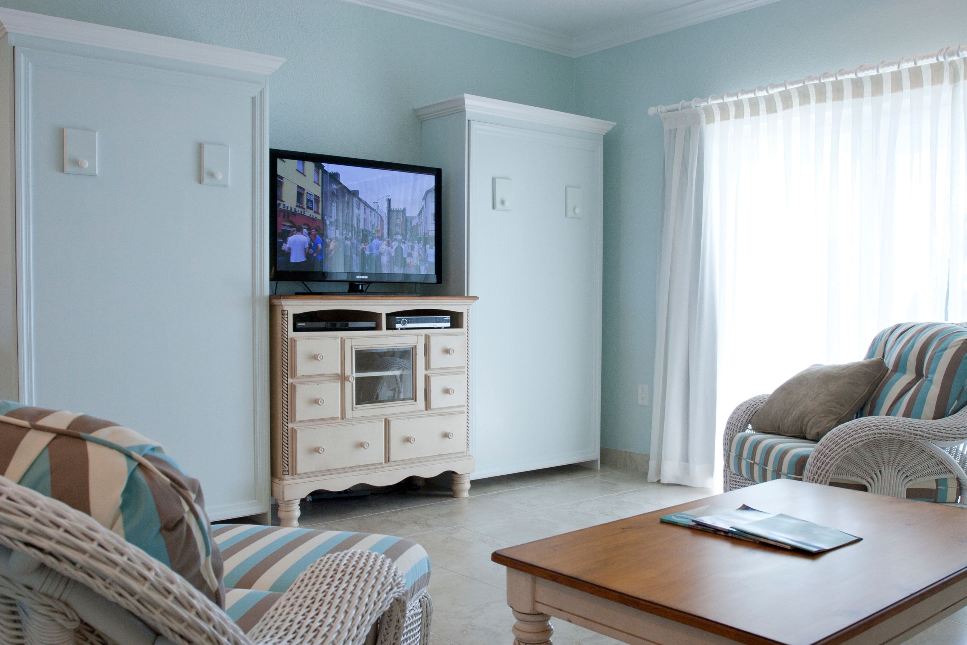 deluxe condo, 1 bedroom, poolside | living area | 42-inch flat-screen tv with cable channels, tv, dvd player