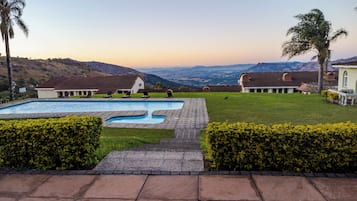 Outdoor pool, pool umbrellas, sun loungers