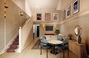 Suite, varias camas, balcón (The Barons Suite - Water View) | Área de sala de estar | Televisión de pantalla plana, estación para iPod y películas con cargo 