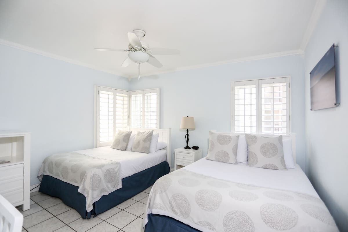 deluxe double room, 2 double beds, non smoking | in-room safe, desk, blackout curtains, iron/ironing board