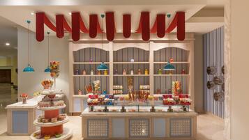 A dessert display with multiple tiers and a variety of sweets.