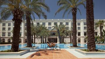 Indoor pool, outdoor pool, pool umbrellas, pool loungers