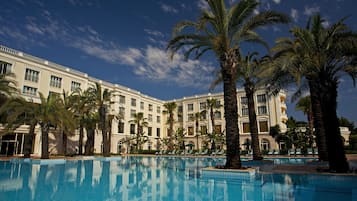 Indoor pool, outdoor pool, pool umbrellas, sun loungers