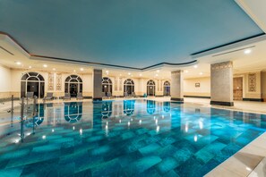 Indoor pool, outdoor pool, pool umbrellas, sun loungers