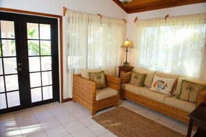 Standard Apartment, Oceanfront | Living area | Flat-screen TV