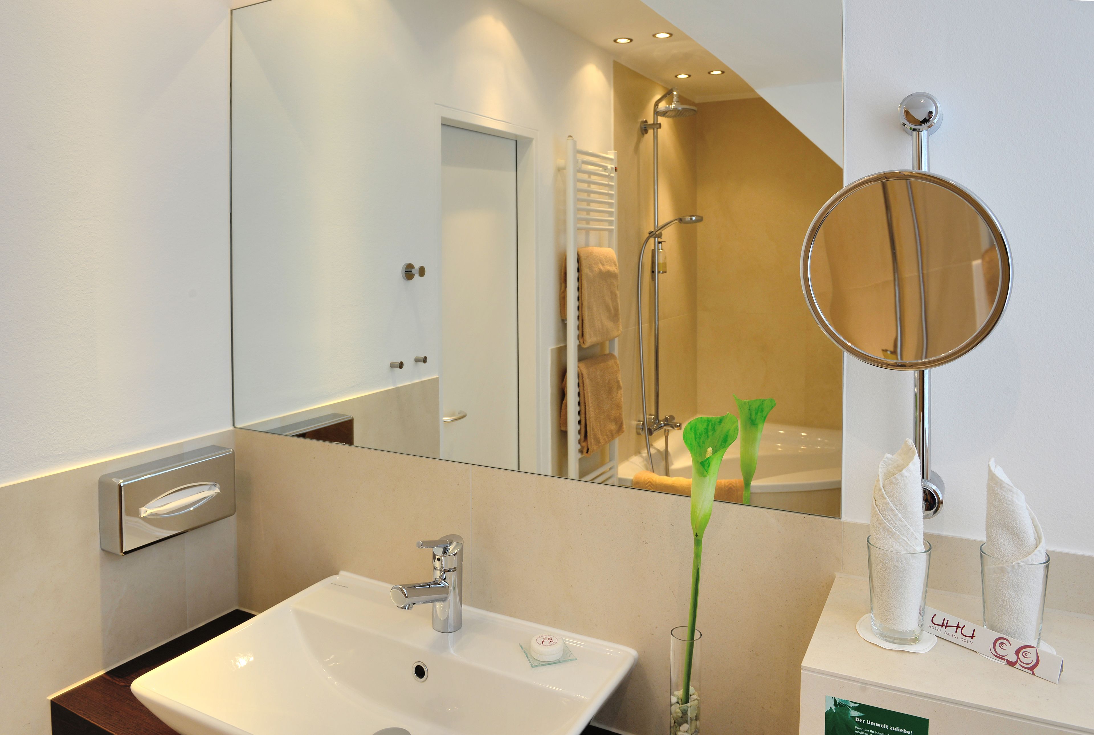 classic studio suite | bathroom | slippers, towels
