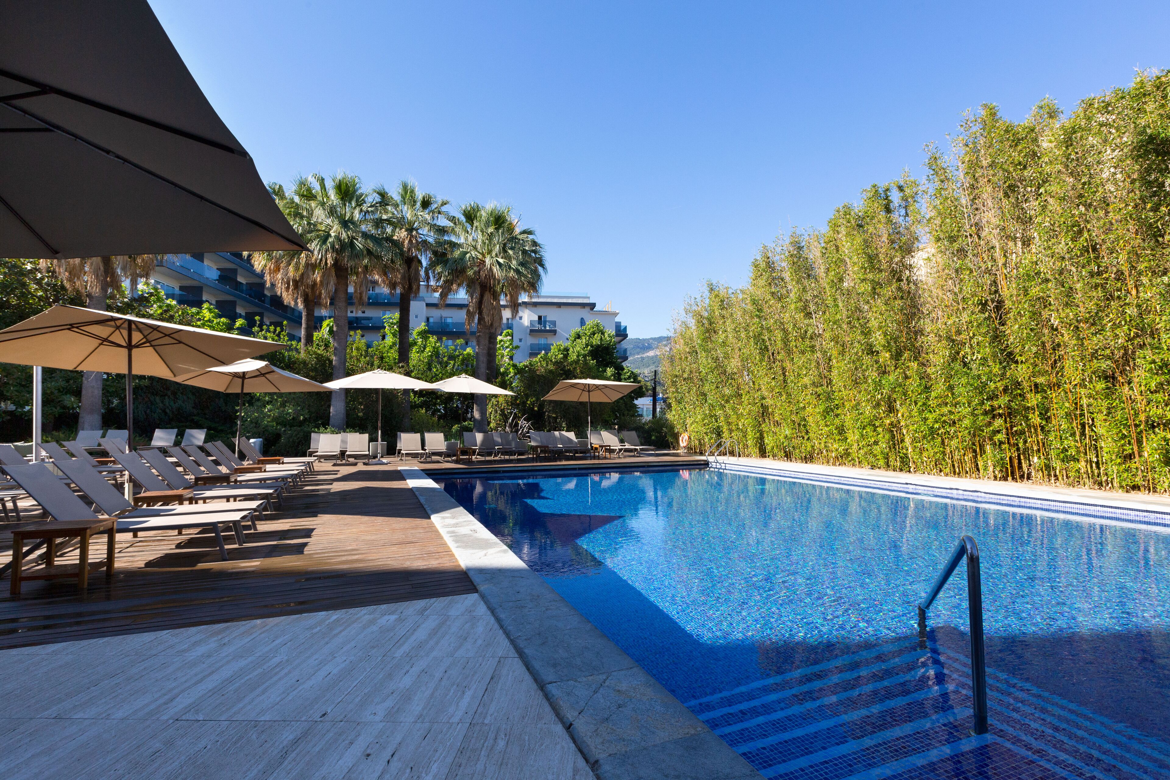 indoor pool, seasonal outdoor pool, pool umbrellas, pool loungers