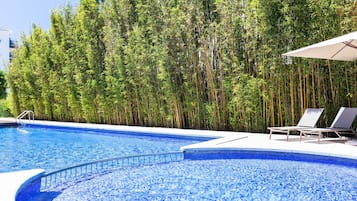 Indoor pool, seasonal outdoor pool, pool umbrellas, sun loungers