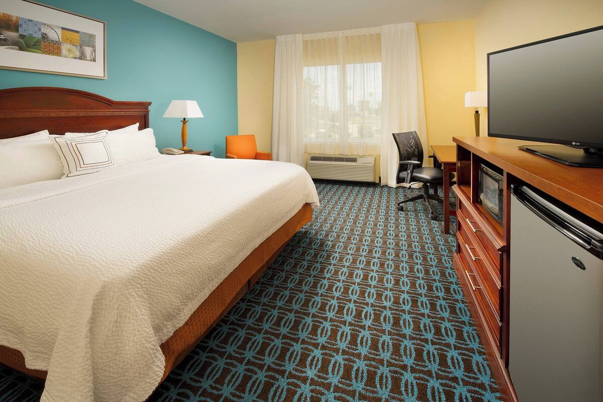 premium bedding, desk, blackout curtains, iron/ironing board