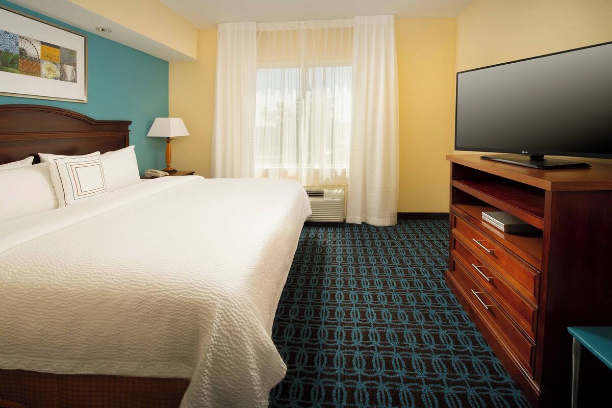 premium bedding, desk, blackout curtains, iron/ironing board