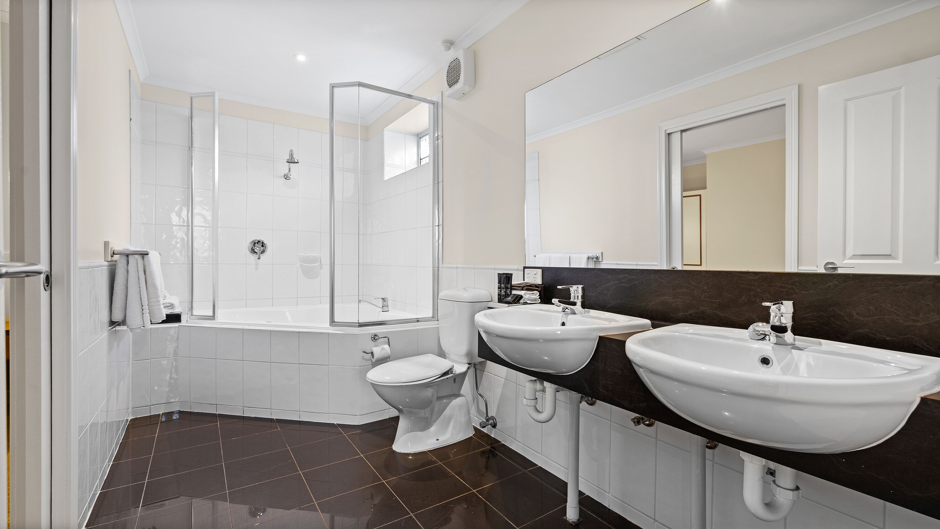Shower, designer toiletries, hair dryer, towels