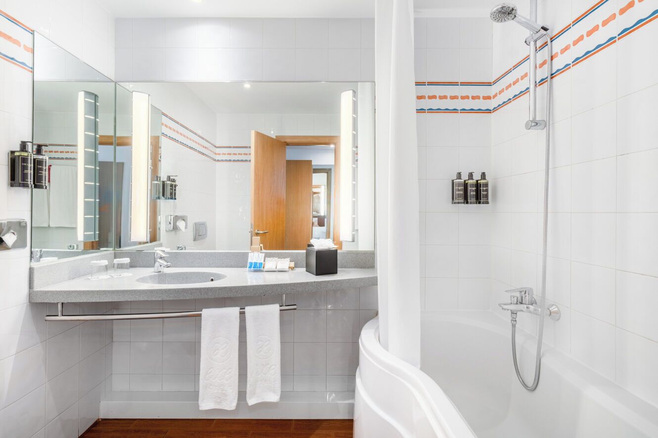 eco-friendly toiletries, hair dryer, towels