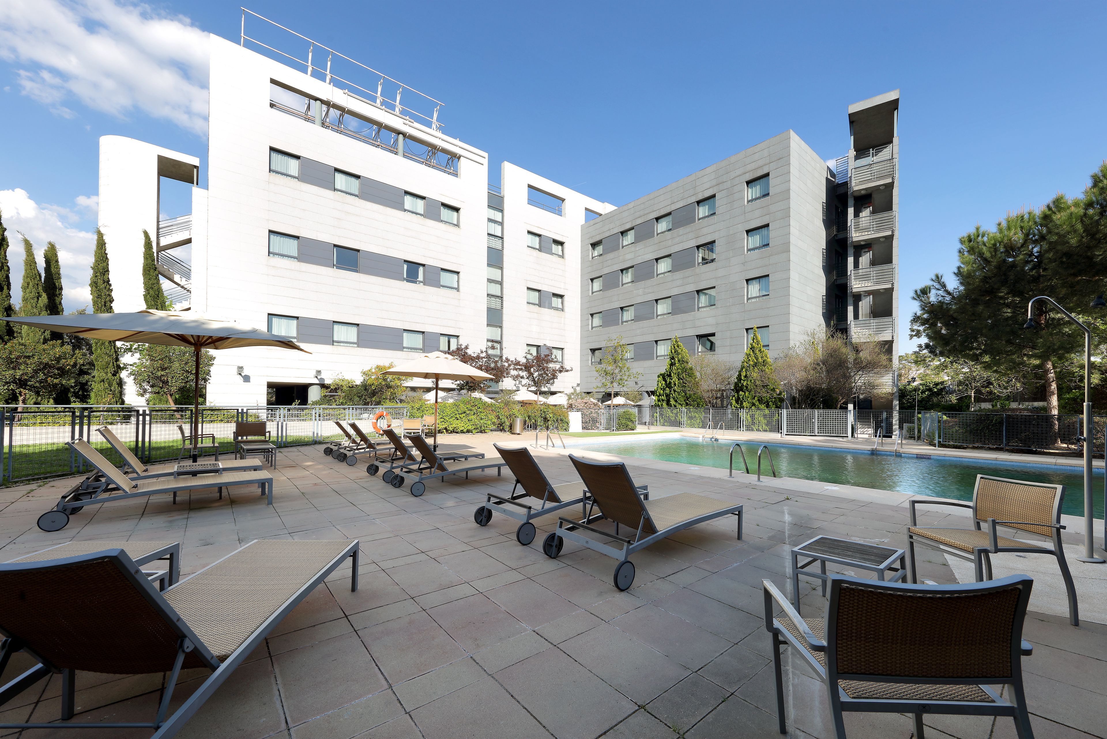 seasonal outdoor pool, open 11:00 am to 7:30 pm, pool umbrellas