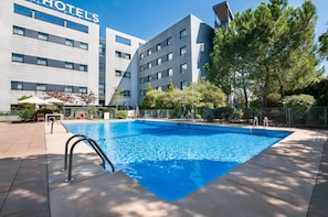 Seasonal outdoor pool, open 11:00 AM to 7:30 PM, pool umbrellas