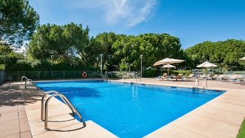 Seasonal outdoor pool, open 11:00 AM to 7:30 PM, pool umbrellas