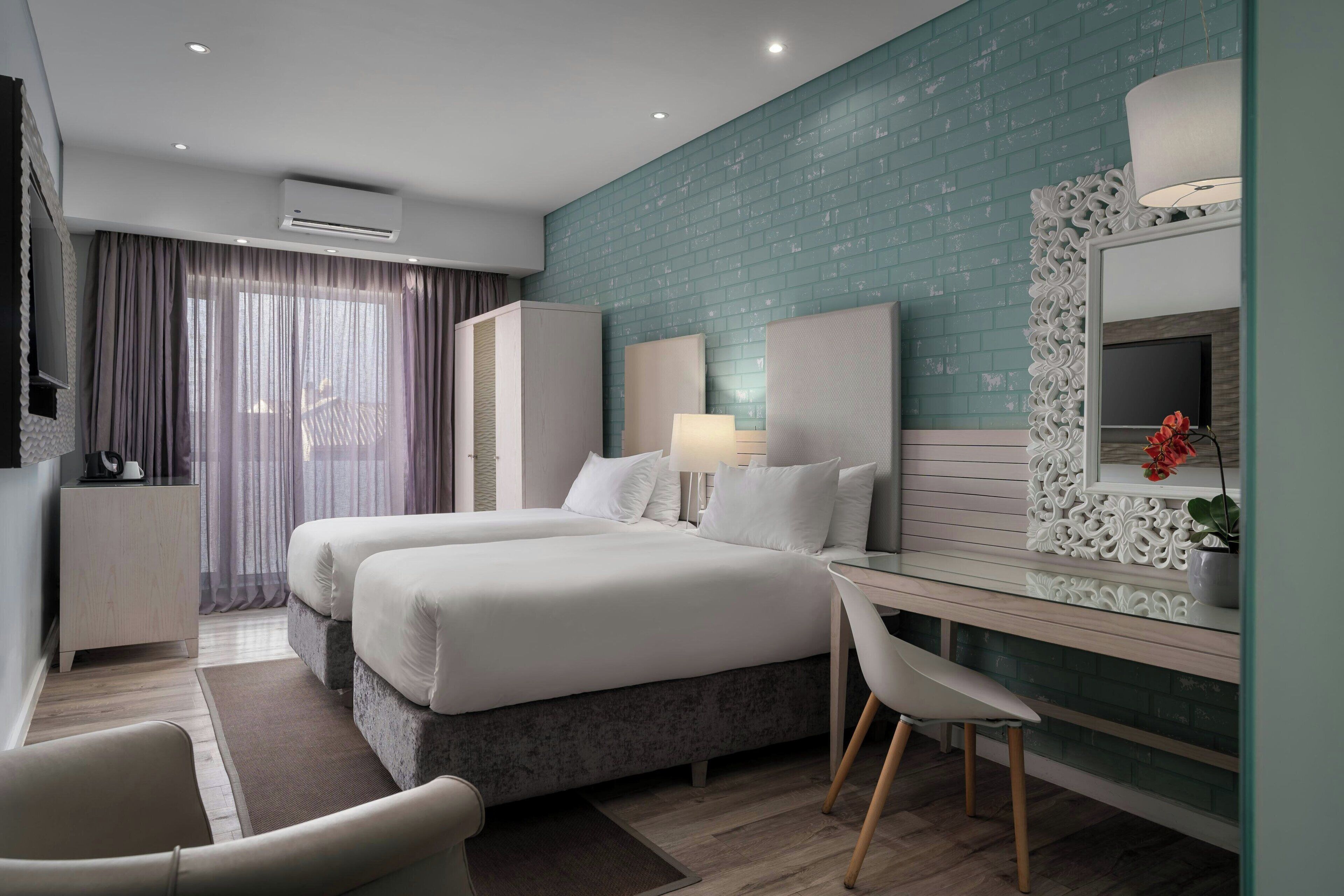 Standard Room, 2 Twin Beds | Down comforters, in-room safe, individually decorated