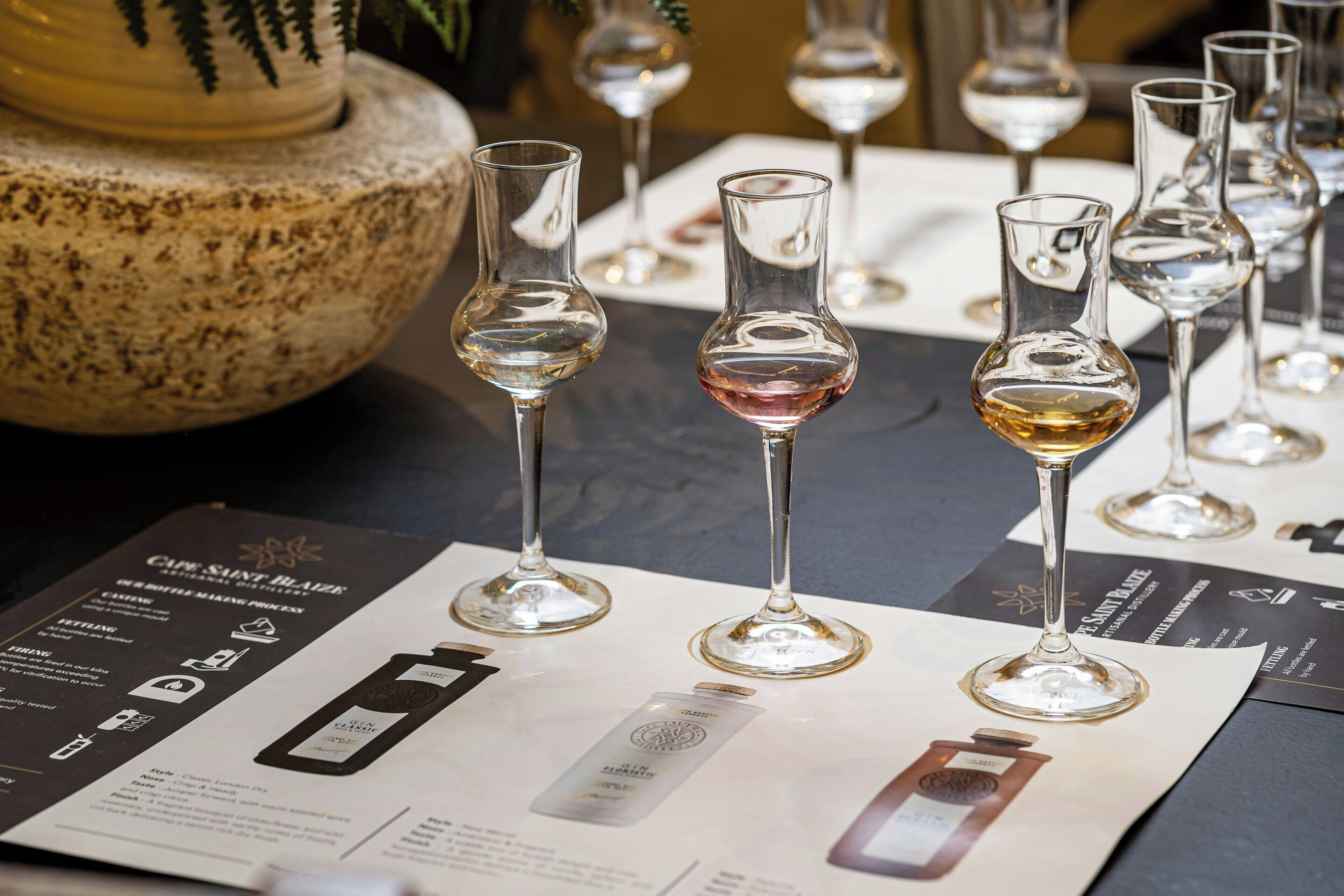 A table with wine glasses and a menu detailing the wine list.