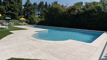 Outdoor pool, open 10:00 AM to 8:30 PM, pool umbrellas, pool loungers