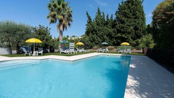 Outdoor pool, open 10:00 AM to 8:30 PM, pool umbrellas, pool loungers