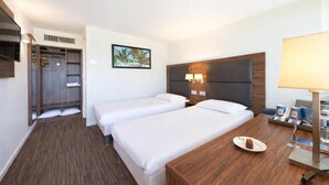 A hotel room with two beds, a wooden desk, a TV, a wardrobe, and a painting on the wall. - Kyriad Bordeaux - Mérignac Aéroport (Merignac)