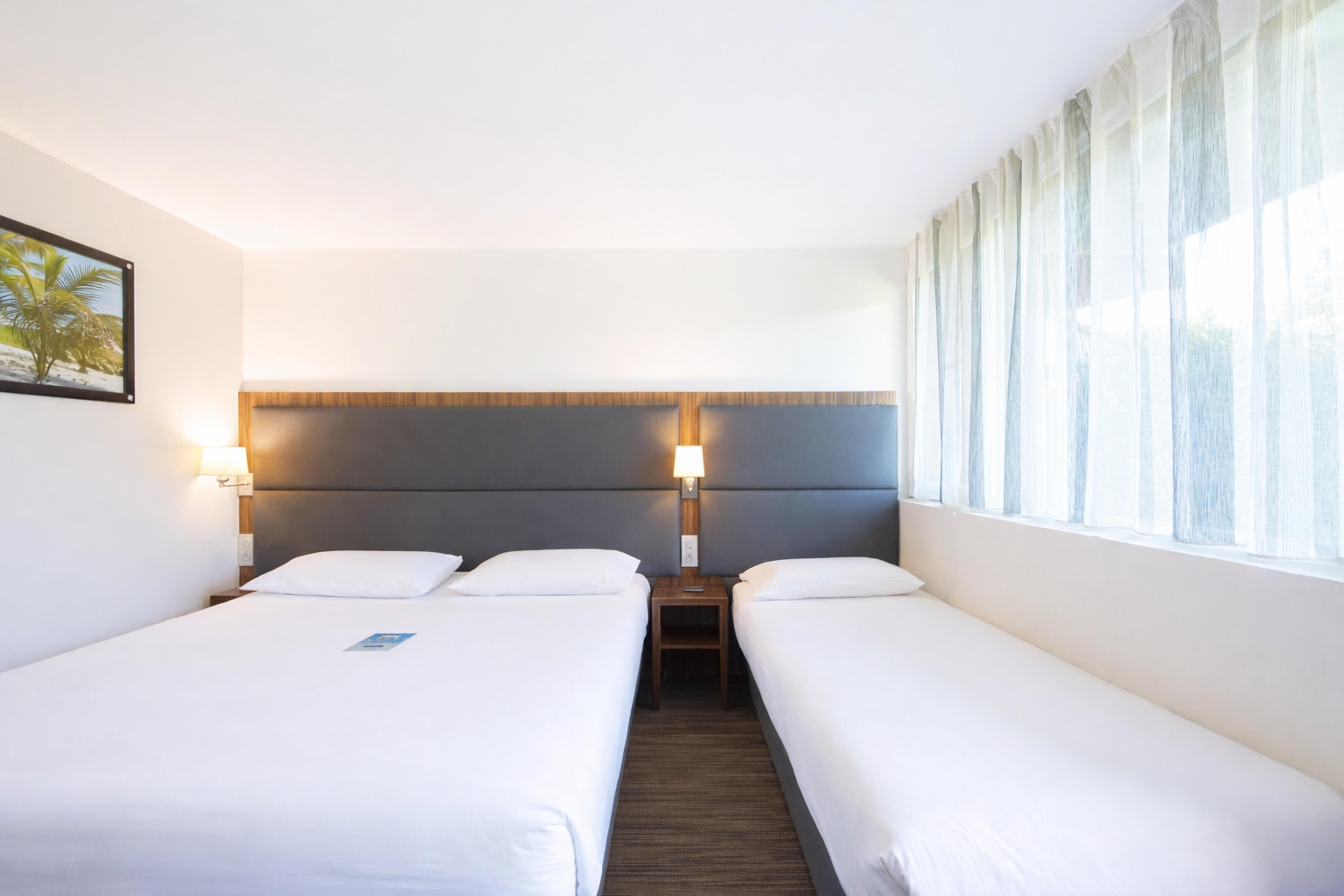 Standard Room, Multiple Beds | Individually furnished, desk, blackout drapes, soundproofing