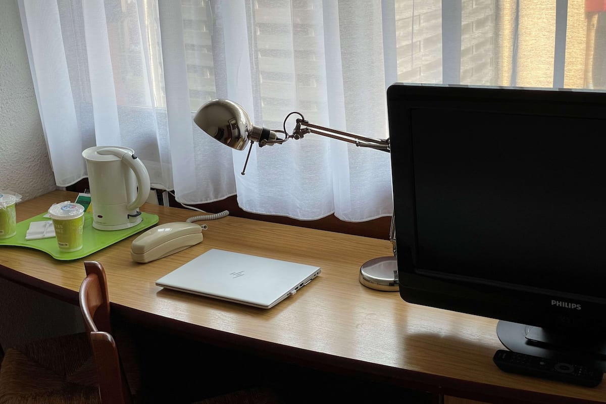 Premium bedding, desk, blackout curtains, soundproofing