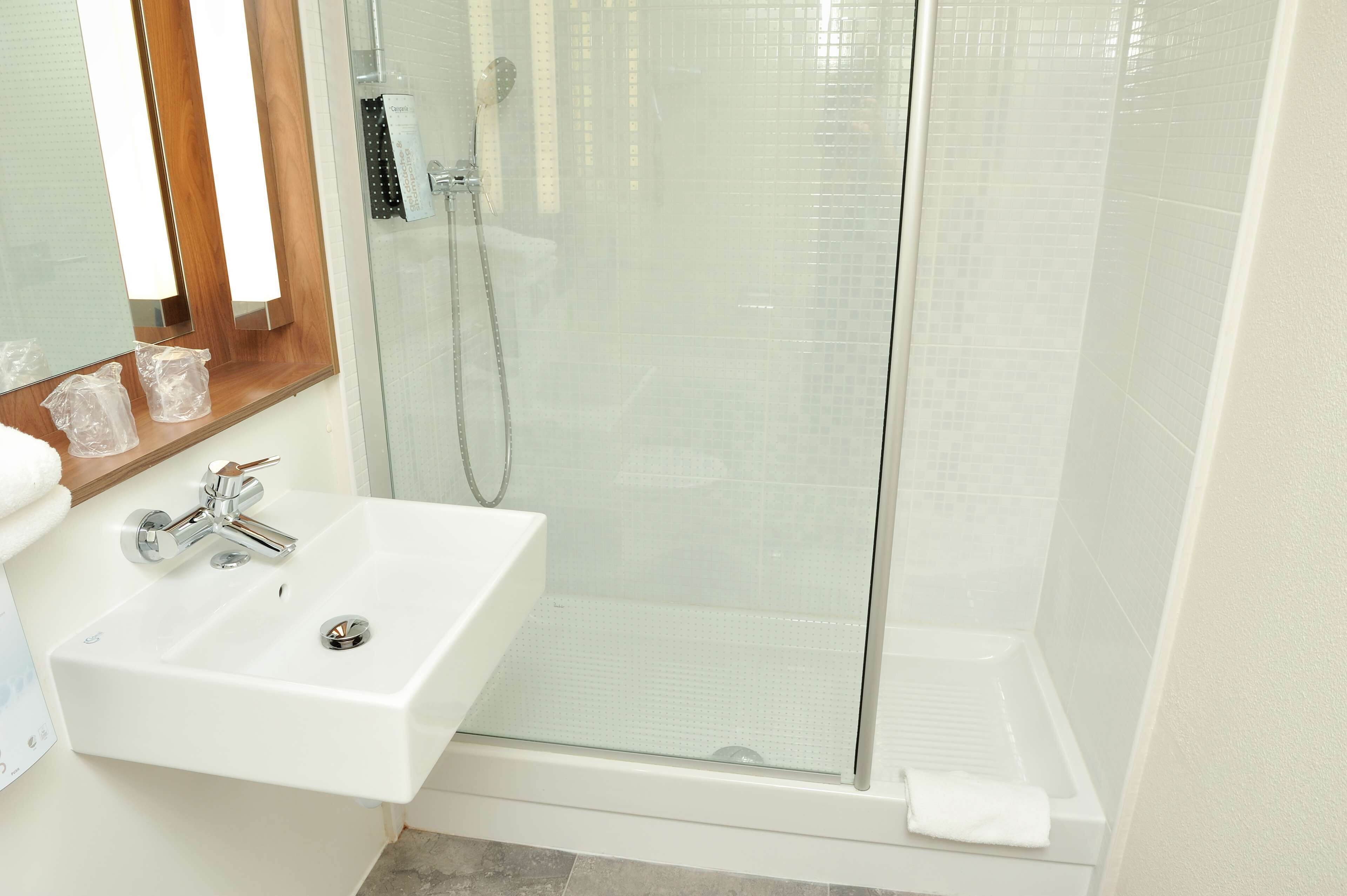 shower, eco-friendly toiletries, hair dryer, towels