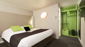 Premium bedding, desk, laptop workspace, blackout drapes