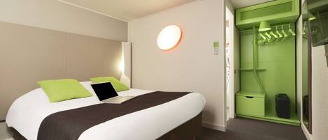 Premium bedding, desk, laptop workspace, blackout curtains