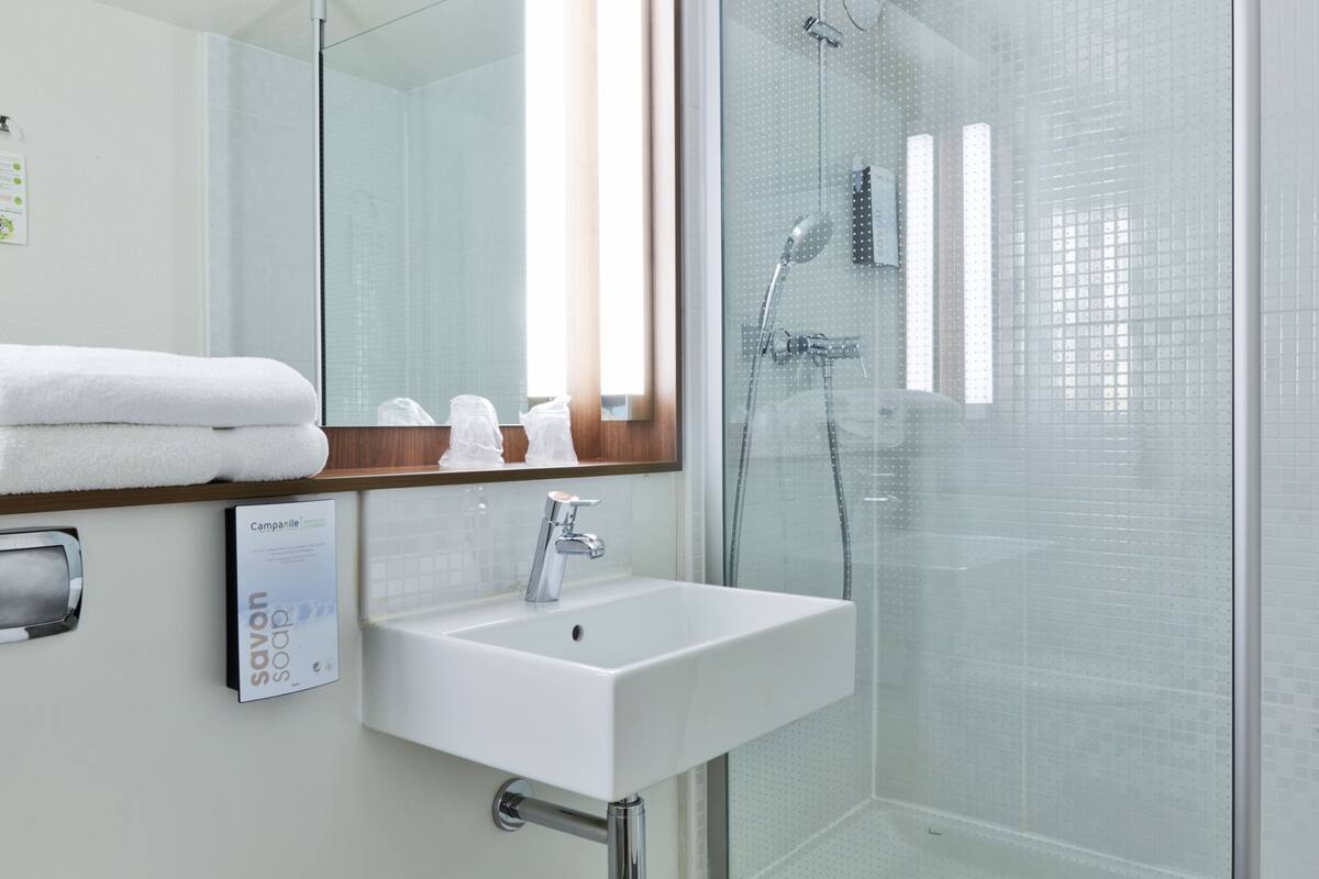 shower, eco-friendly toiletries, hair dryer, towels